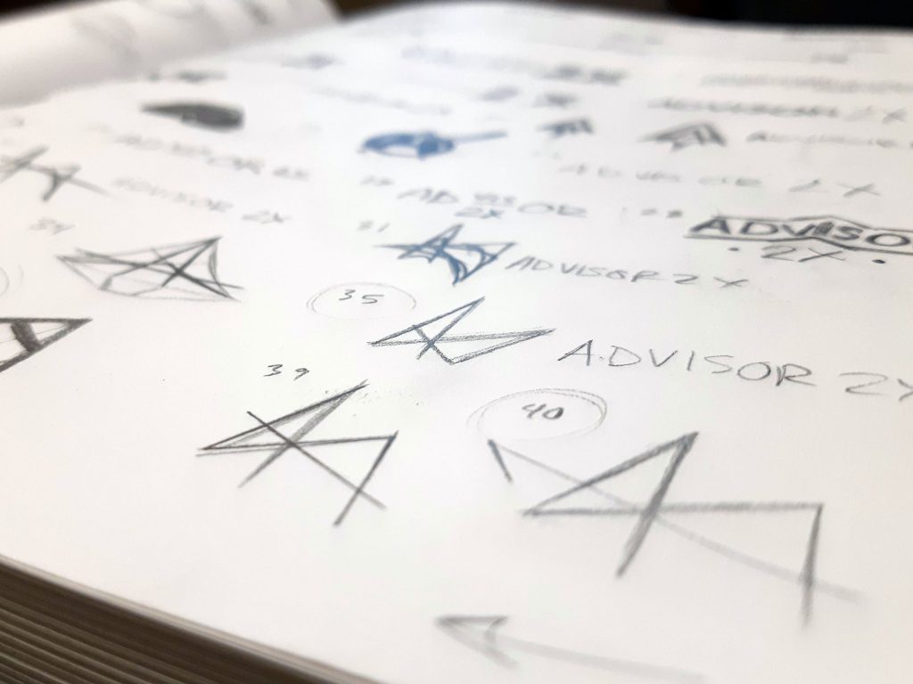 Snapshot of the sketchbook with doodles that ultimately lead to the final Advisor2X logo design