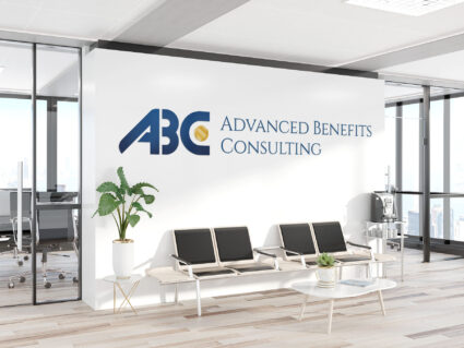 ABC logo decal, large, displayed on a white wall in an office space