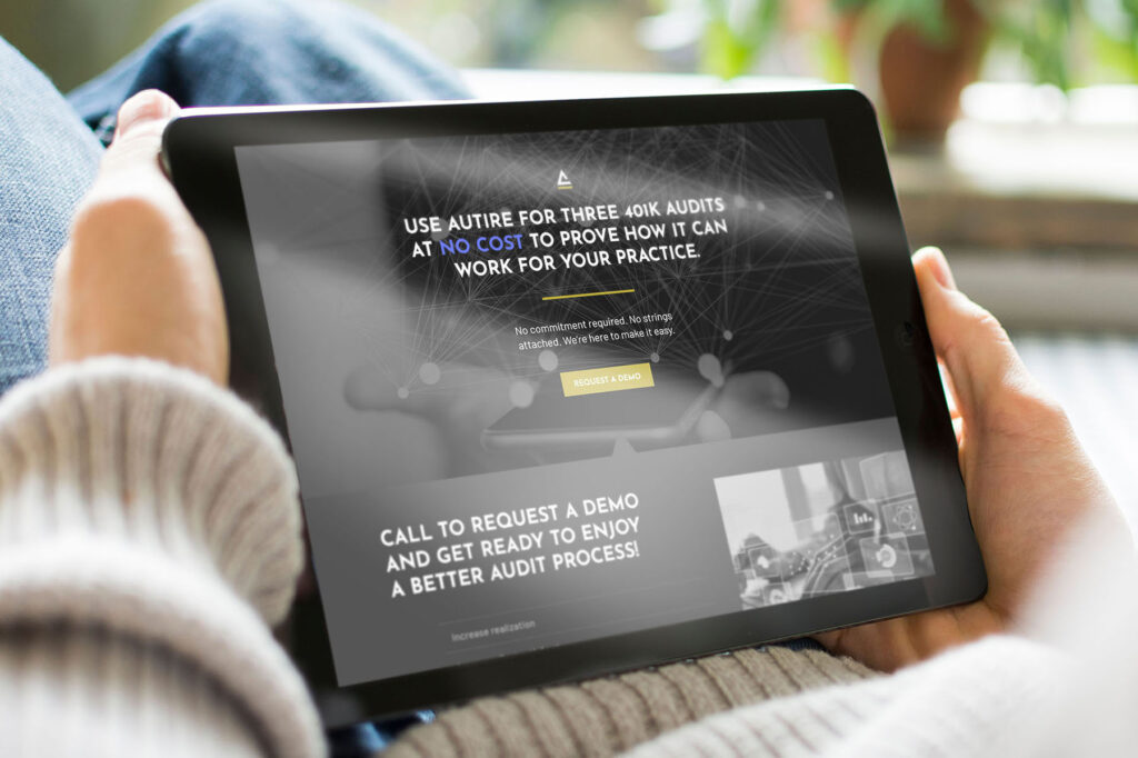 Autire web design displayed on a handheld tablet