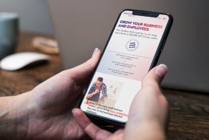 FastStart 401k home page design displayed on a smartphone