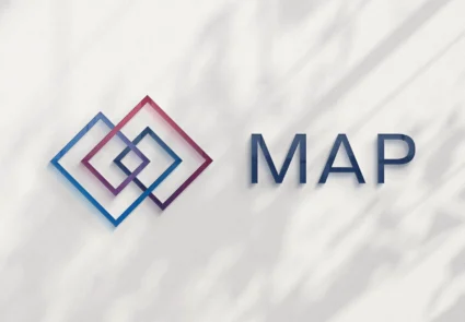 The MAP logo mounted on a wall as a glossy, 3-dimensional sign
