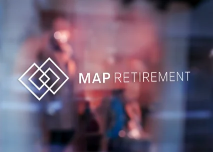 Binary White version of the MAP Retirement logo as a decal displayed on a glass door