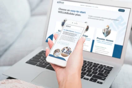 WELLthBuilder website displayed across a laptop and smartphone screen.